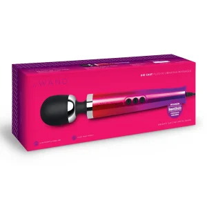 The Le Wand Diecast Plug In Vibrating Wand Massager, in pink and black, is shown in its box with product details and a "Winner" award label. The massager is prominently displayed on the front of the packaging.