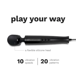The Le Wand Diecast Plug In Vibrating Wand Massager features a black design with labelled highlights: flexible silicone head, 10 vibration speeds, and 20 patterns. Above the wand, the phrase "play your way" is displayed.