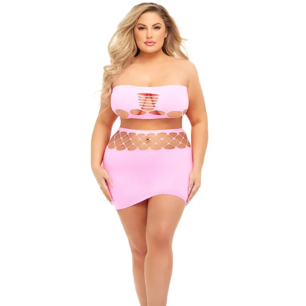 A woman with long blonde hair models the Pink Lipstick Plus Size Net Worth 2 Pcs Bandeau Set, a light pink strapless 2pc set with cut-out designs, standing against a plain white background.