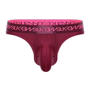 Maroon Sukrew Clavet Classic Thong for men featuring a wide pink lettered waistband with the "SUKREW" brand in bold capitals and a prominent front pouch design.