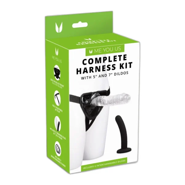 A product package labelled "Complete Harness Kit" with 5” and 7” dildos includes an image of a harness with a clear dildo attached and a black dildo beside it. The box is white and green with product information.