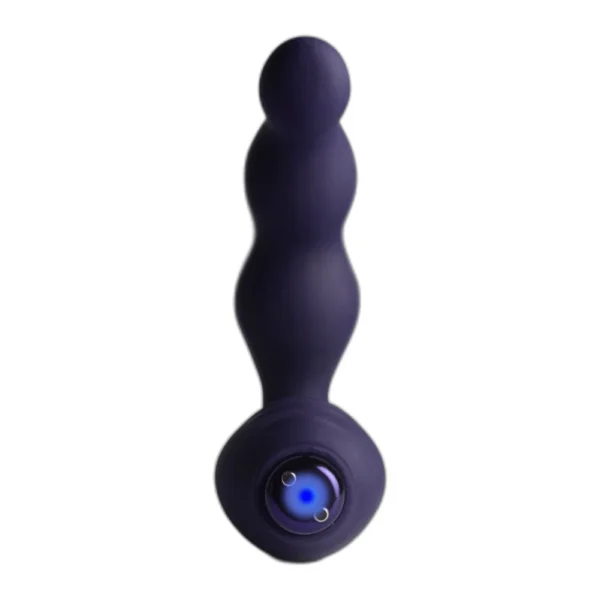 A dark purple silicone anal beads vibrator with a rounded, beaded shaft and a flat circular base featuring a charging port. The toy is designed for personal use.