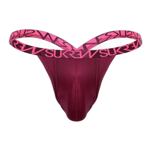 sukrew-claret-bubble-thong-front A burgundy thong with a wide pink elastic waistband featuring bold black "SUREW" text in a repeating pattern. The thong is laid flat against a white background.