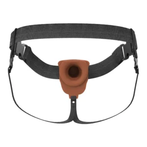 A brown and black strap-on harness with adjustable waist and thigh straps, featuring a central silicone O-ring for attaching compatible accessories.