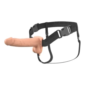 A realistic flesh-coloured strap-on dildo attached to adjustable black harness straps with plastic buckles.