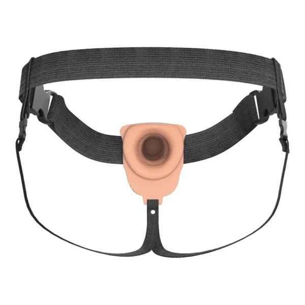 A wearable strap-on harness with a flesh-coloured silicone attachment at the centre, designed for securing and holding objects. The harness has adjustable black straps and plastic buckles for fastening.