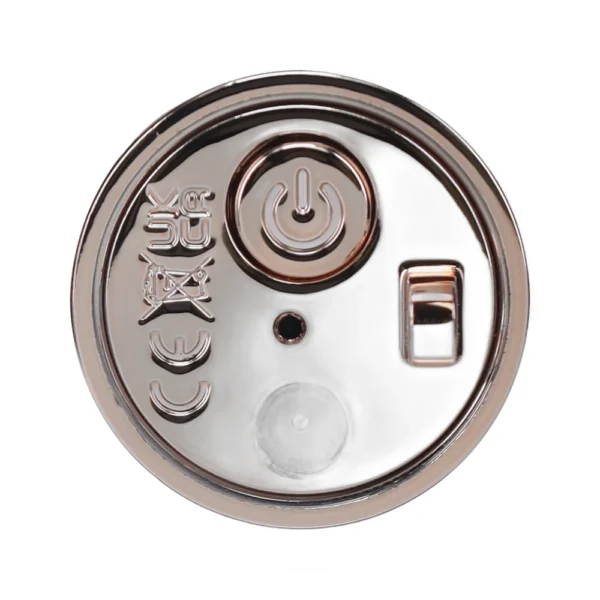 A close-up view of a metallic, circular device bottom showing a power button, a sliding switch, a small black dot, symbols including CE and crossed-out bin, and a translucent round area.