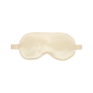 A beige silk sleep mask with a matching elastic strap, displayed against a white background.