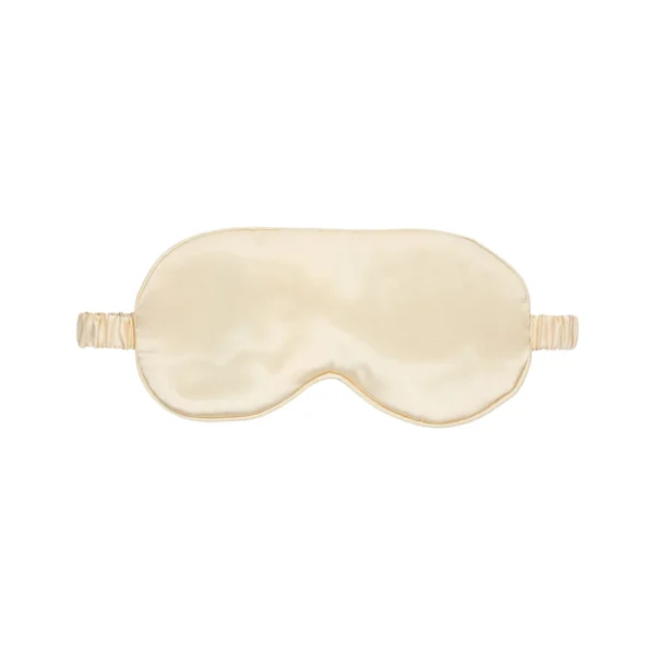 A beige silk sleep mask with a matching elastic strap, displayed against a white background.