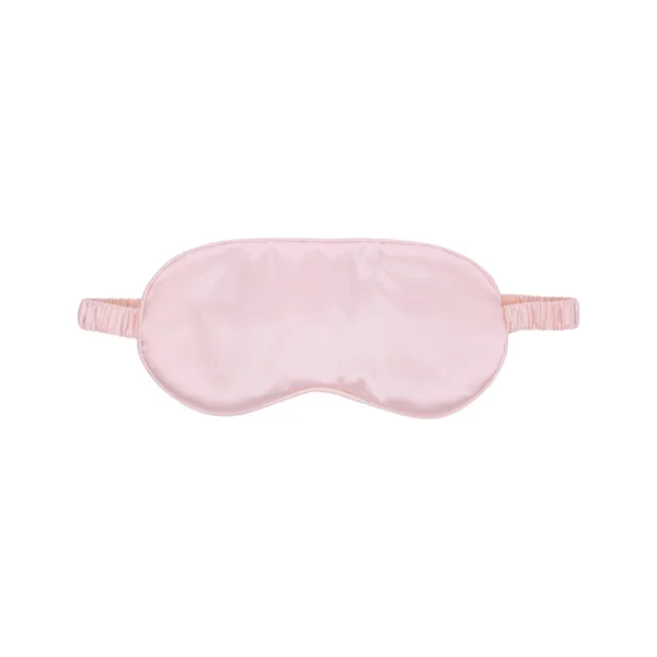 A light pink silk sleep mask with an elastic strap, displayed on a plain white background.
