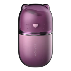 A purple, capsule-shaped object with a smooth finish, featuring a cat-shaped lid with ears and simple whisker details. The word "SVAKOM" is printed vertically on the lower part.