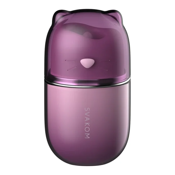 A purple, capsule-shaped object with a smooth finish, featuring a cat-shaped lid with ears and simple whisker details. The word "SVAKOM" is printed vertically on the lower part.