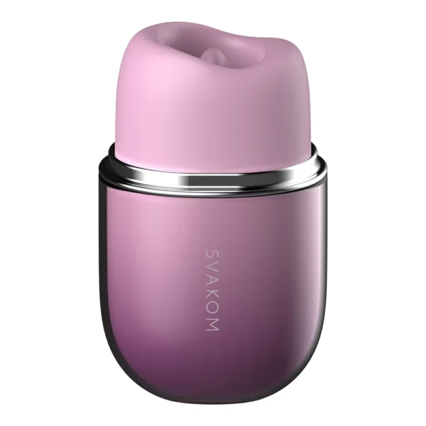 A pink and purple cylindrical device with a soft, rounded top and the word "SVAKOM" printed vertically on the front. The object has a metallic ring separating the top and bottom sections.