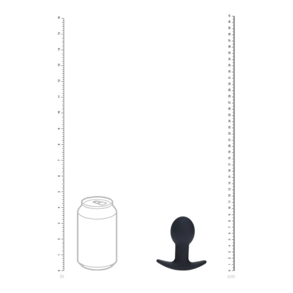A size comparison showing a soft drink can outline next to a small, black, rounded object with a wide base, alongside rulers in inches and centimetres on each side.
