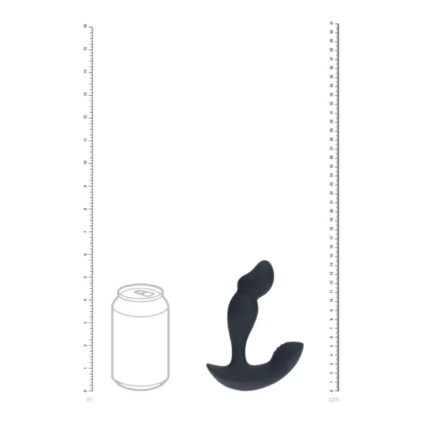 Black silicone prostate massager shown upright beside a fizzy drink can outline for size comparison; rulers in inches and centimetres are on each side of the image.