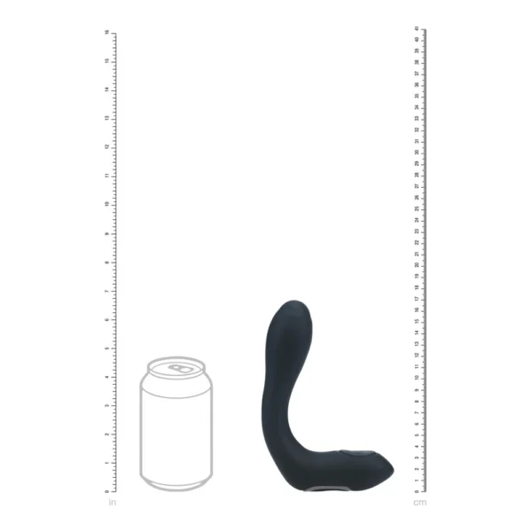 A black, curved silicone object stands upright next to a fizzy drink can illustration. Rulers in inches and centimetres frame both sides, showing the object’s size relative to the can.