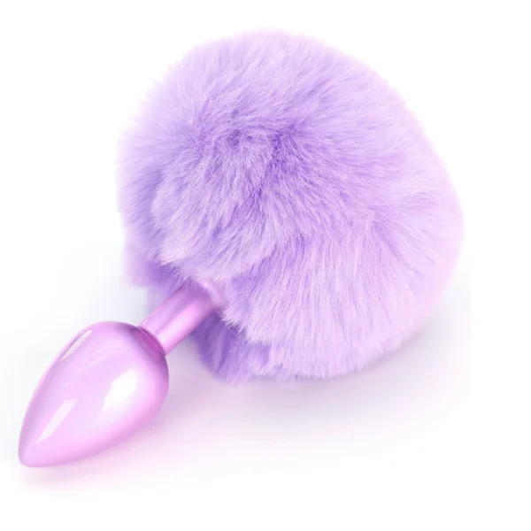 A shiny, purple metal plug with a large, fluffy, light purple faux fur ball attached to one end, displayed on a white background.