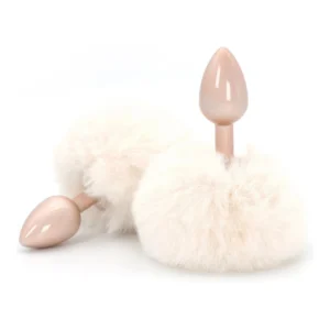 Two pink plug-shaped objects with attached fluffy white pom-poms, displayed on a white background.