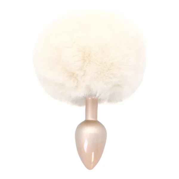 A light beige faux fur tail attached to a small, metallic, teardrop-shaped plug, photographed on a white background.